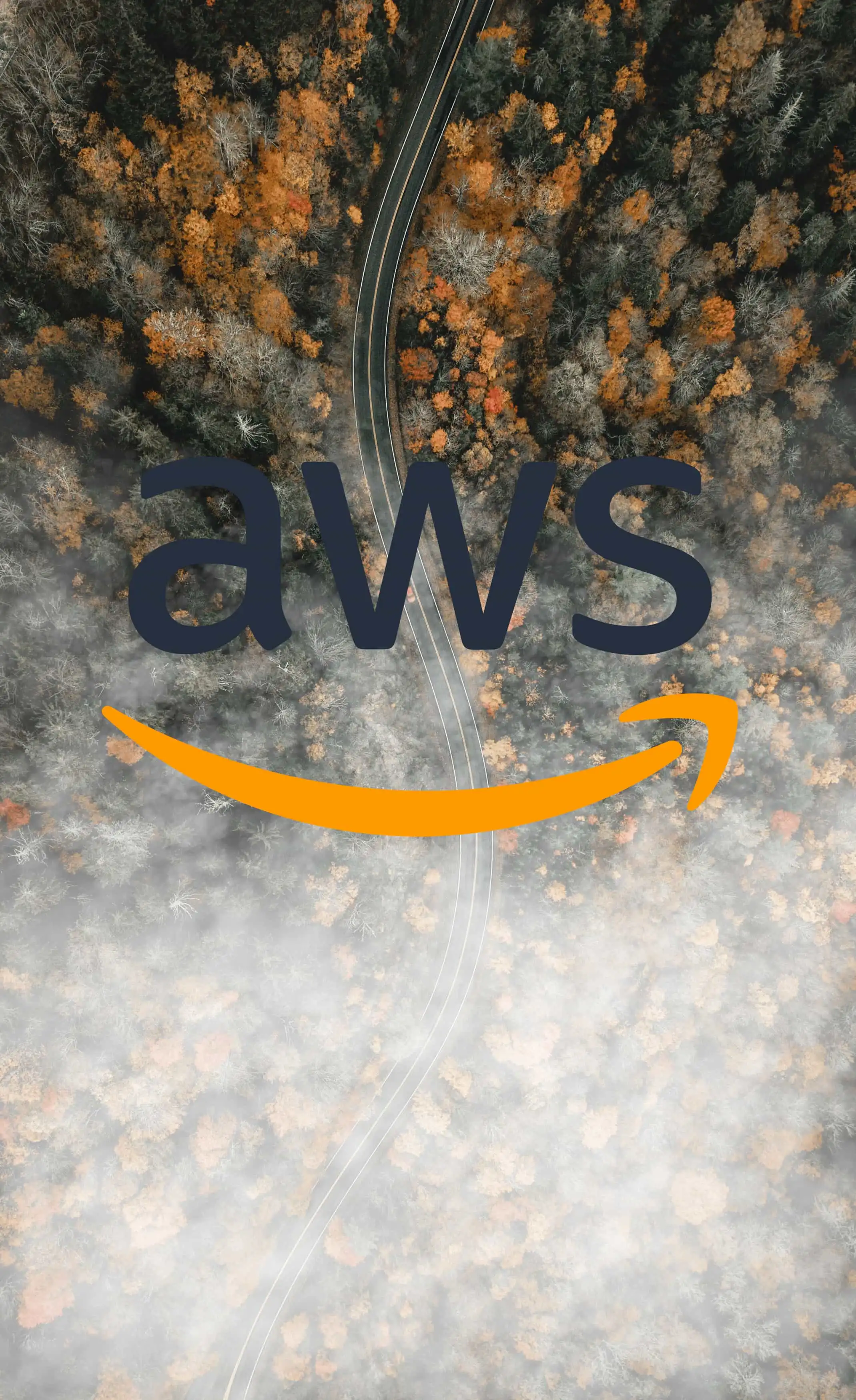 Foggy road during fall with AWS logo as transition between fog and clear forest